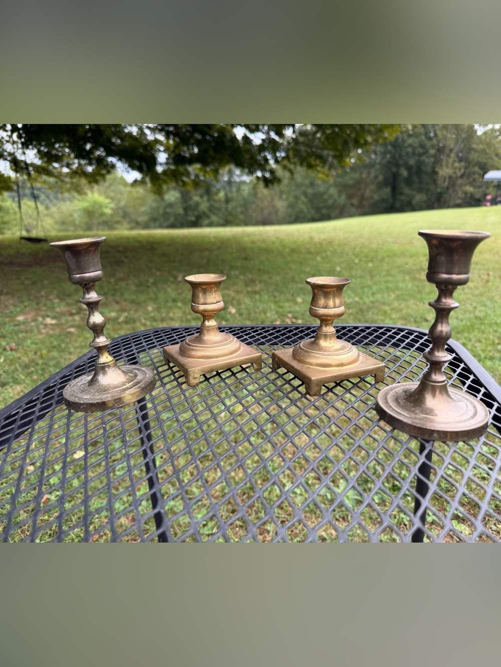 set of four vintage solid brass candlestick holders